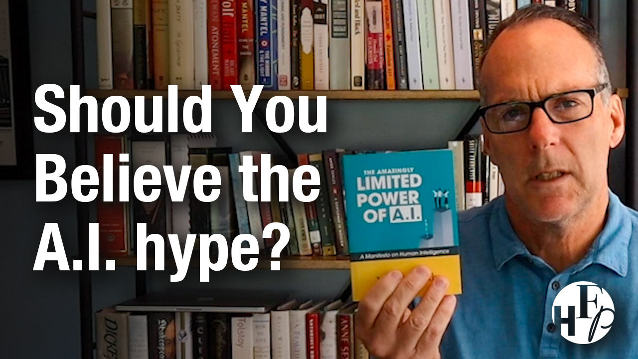 Load video: Author Michael Faeth holds up a copy of his book The Amazingly Limited Power of A.I. A Manifesto on Human Intelligence. The caption "Should You Believe the A.I. Hype?" is shown.